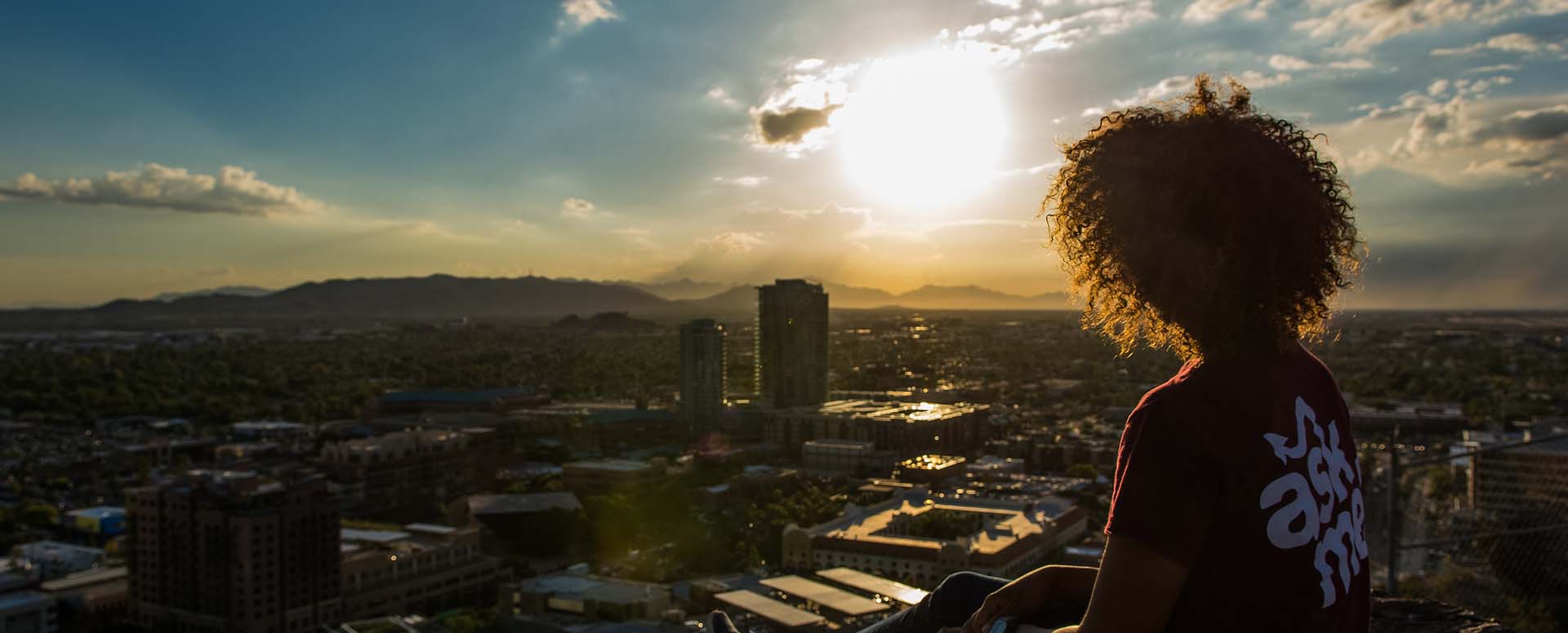 Student looking out over A mountain