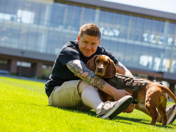 veteran student with dog