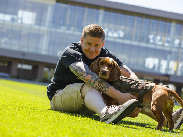 veteran student with dog